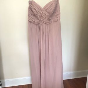 Beige strapless bridesmaid dress.
